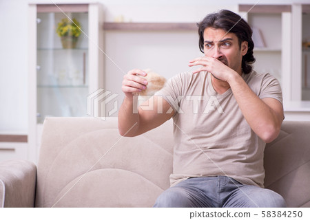 Young man suffering from allergy 58384250