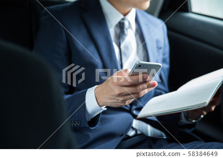 Man working in a car 58384649