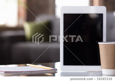 Mock up empty black tablet screen on blured background Mock up empty black tablet screen on blured background 58385526