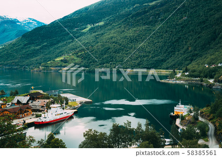 Flam, Norway. Touristic Ship Boat Moored Near Berth In Sognefjord Port. Aerial View In Summer Flam, Norway. Touristic Ship Boat Moored Near Berth In Sognefjord Port. Aerial View In Summer 58385561