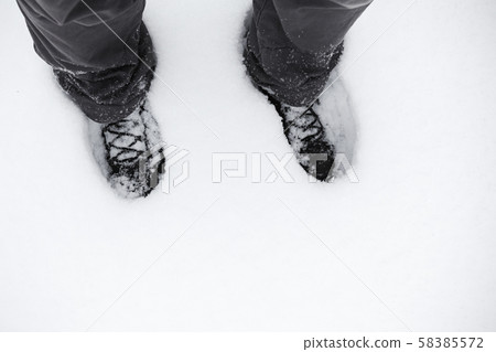 Back shoes standing in deep snow 58385572