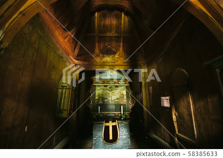 Borgund, Norway. Interior Of Famous Wooden Norwegian Landmark Stavkirke. Ancient Old Wooden Triple Borgund, Norway. Interior Of Famous Wooden Norwegian Landmark Stavkirke. Ancient Old Wooden Triple 58385633