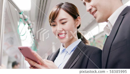 people use smartphone on mrt 58385995