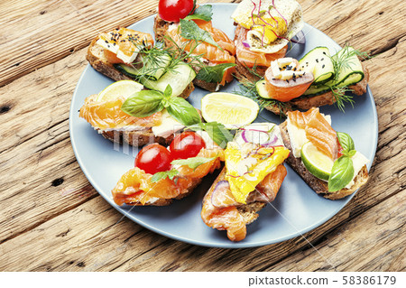 Assorted bruschetta with fish Assorted bruschetta with fish 58386179