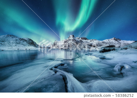 Aurora Borealis, Lofoten islands, Norway. Mountains and frozen ocean. Aurora Borealis, Lofoten islands, Norway. Mountains and frozen ocean. 58386252