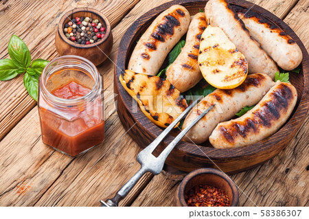 Grilled sausages with vegetables 58386307