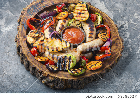 Fried sausages with sauces 58386527