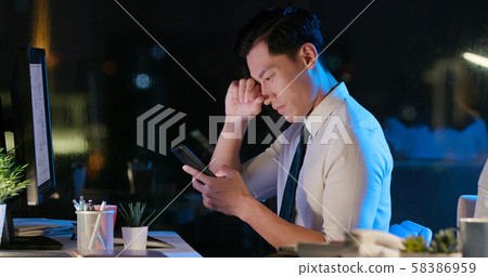 asian businessman feel eye pain 58386959