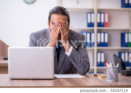 Unhappy male businessman in the office 58387114