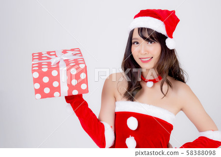 Beautiful portrait young asian woman happy holding red gift box with excited in xmas holiday Beautiful portrait young asian woman happy holding red gift box with excited in xmas holiday 58388098
