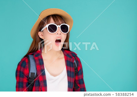 Beautiful young asian woman shouting sound loud with mouth for announce something in vacation 58388254