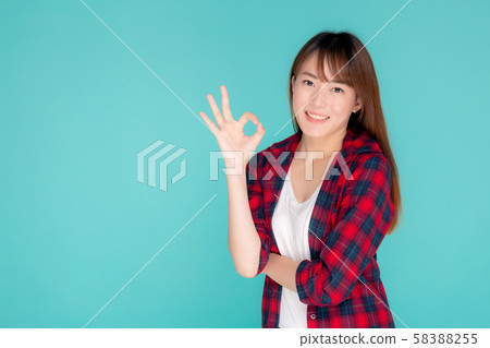 Beautiful portrait young asian woman smiling confident and excited summer holiday isolated Beautiful portrait young asian woman smiling confident and excited summer holiday isolated 58388255
