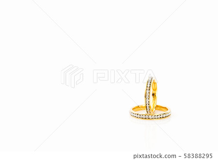 Gold wedding rings on white background Gold wedding rings on white background 58388295