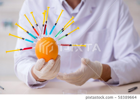 Male nutrition expert testing food products in lab Male nutrition expert testing food products in lab 58389664