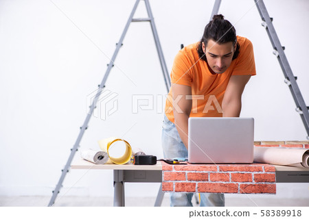 Young man contractor doing renovation at home 58389918