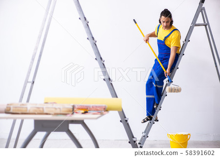 Young man contractor doing renovation at home 58391602