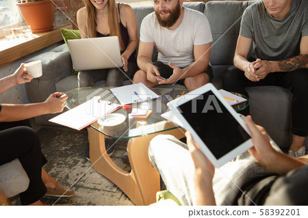Group of young caucasian office workers have creative meeting to discuss new ideas Group of young caucasian office workers have creative meeting to discuss new ideas 58392201