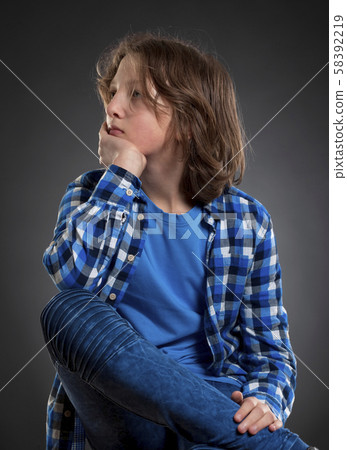 Portrait of a Boy with Brown Hair Outdoors. Portrait of a Boy with Brown Hair Outdoors. 58392219
