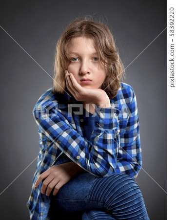 Portrait of a Boy with Brown Hair Outdoors. Portrait of a Boy with Brown Hair Outdoors. 58392220