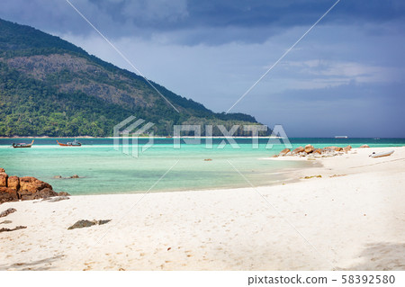 paradise beach in Thailand during storm with tall palms paradise beach in Thailand during storm with tall palms 58392580
