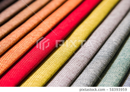 Colorful and bright fabric samples of furniture and clothing upholstery. Close-up of a palette of Colorful and bright fabric samples of furniture and clothing upholstery. Close-up of a palette of 58393959