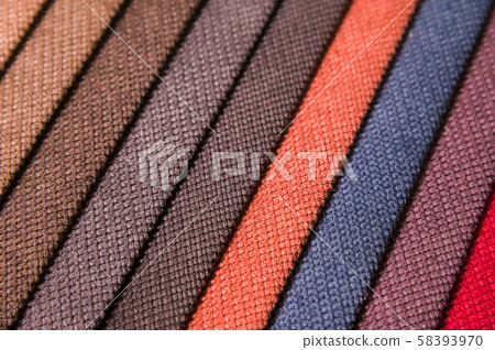 Colorful and bright fabric samples of furniture and clothing upholstery. Close-up of a palette of 58393970