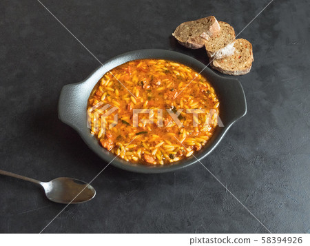 Delicious Italian sausage soup with orzo. Top view Delicious Italian sausage soup with orzo. Top view 58394926