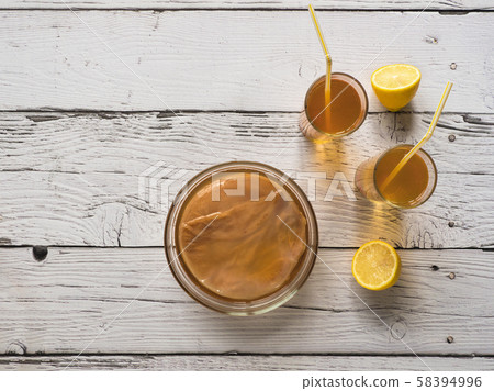 Organic fermented tea drink Kombucha with lemon 58394996