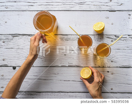 Organic fermented tea drink Kombucha with lemon 58395036