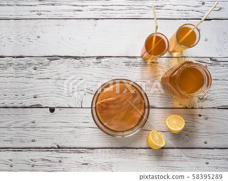 Organic fermented tea drink Kombucha with lemon 58395289