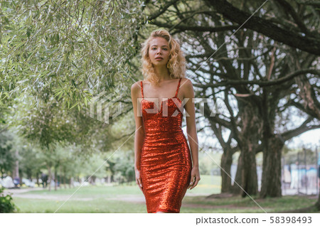 Portrait of beautiful girl in red short dress with 58398493