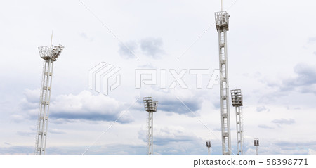 Panoram view of six light towers on gray sky backdrop at stadium. Panoram view of six light towers on gray sky backdrop at stadium. 58398771