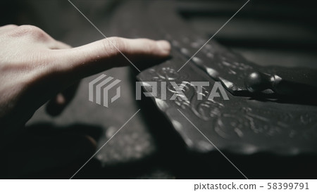 Forge workshop. The product is artificially aged. Gold powder painting of scratches, roughness and 58399791