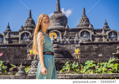 Young woman tourist in budhist temple Brahma Vihara Arama Banjar Bali, Indonesia Young woman tourist in budhist temple Brahma Vihara Arama Banjar Bali, Indonesia 58400047