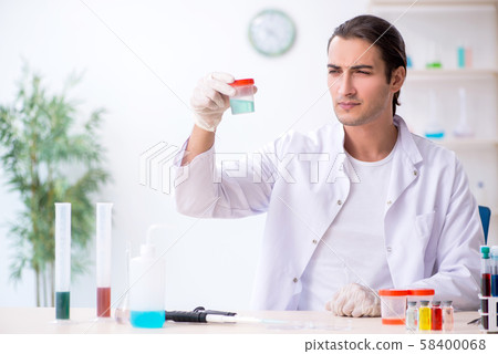 Young male chemist working in the lab Young male chemist working in the lab 58400068