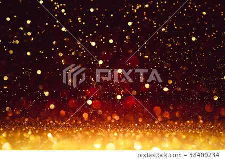 Christmas Background. Golden Glitter On Shiny Red Christmas Background. Golden Glitter On Shiny Red 58400234