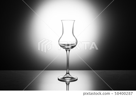 Beautiful elegant shotglass of grappa in the Beautiful elegant shotglass of grappa in the 58400287