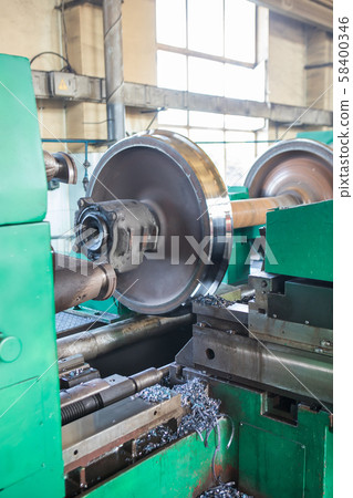 Rail wheelset in a lathe. Repair shop of railway 58400346
