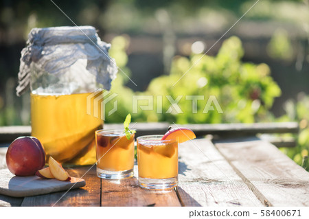 Homemade fermented raw kombucha tea with different Homemade fermented raw kombucha tea with different 58400671
