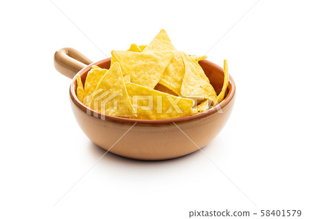 Corn nacho chips. Yellow tortilla chips in bowl. Corn nacho chips. Yellow tortilla chips in bowl. 58401579