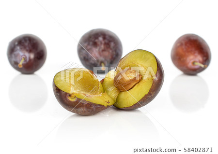 Sweet purple plum isolated on white 58402871