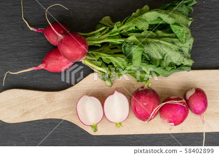Fresh red radish on grey stone Fresh red radish on grey stone 58402899