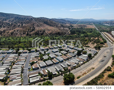 Aerial view of highway crossing a little town in California Aerial view of highway crossing a little town in California 58402954