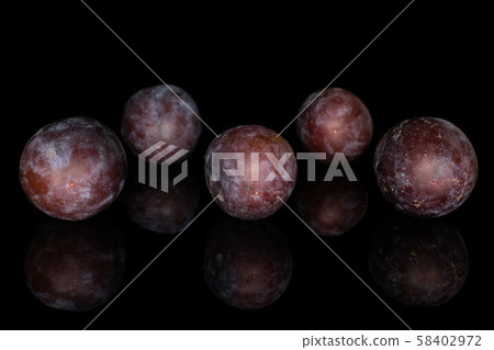 Sweet purple plum isolated on black glass Sweet purple plum isolated on black glass 58402972