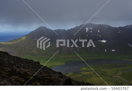 Northern summer landscape, View on beautiful snow covered cliffs and fljotsvatn lake in Fljotavik Northern summer landscape, View on beautiful snow covered cliffs and fljotsvatn lake in Fljotavik 58403767