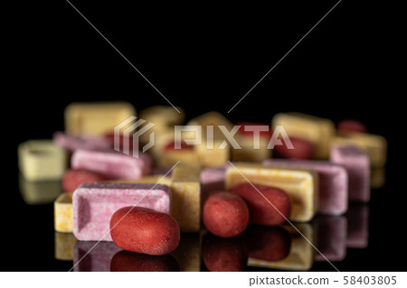 Sweet pastel candy isolated on black glass Sweet pastel candy isolated on black glass 58403805