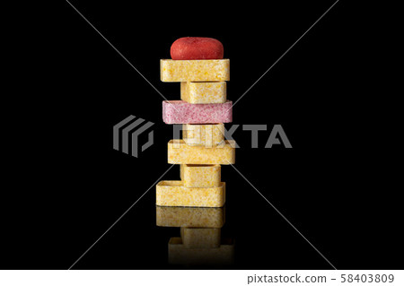 Sweet pastel candy isolated on black glass Sweet pastel candy isolated on black glass 58403809