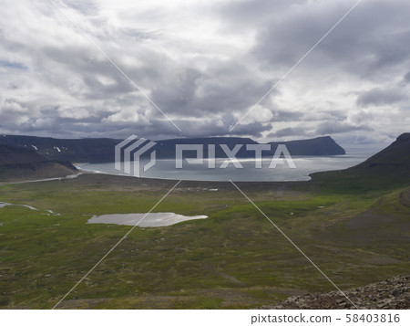 View on adalvik and latrar in west fjords nature reserve Hornstrandir in Iceland with lake and river 58403816