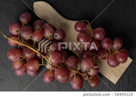 Rose wine grape on grey stone 58404129