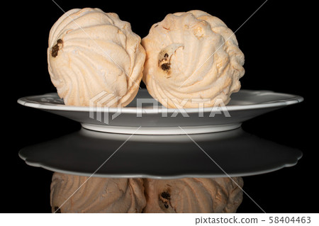 Fresh pastel sweet zefir isolated on black glass Fresh pastel sweet zefir isolated on black glass 58404463